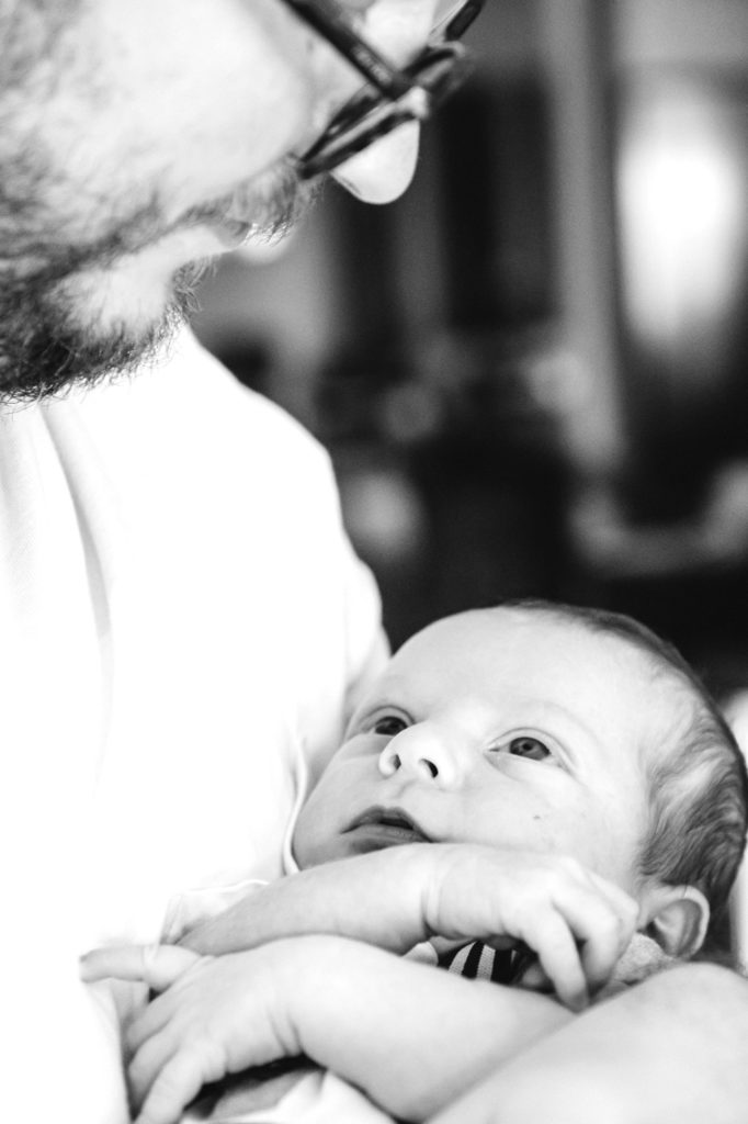 baby gazing at father